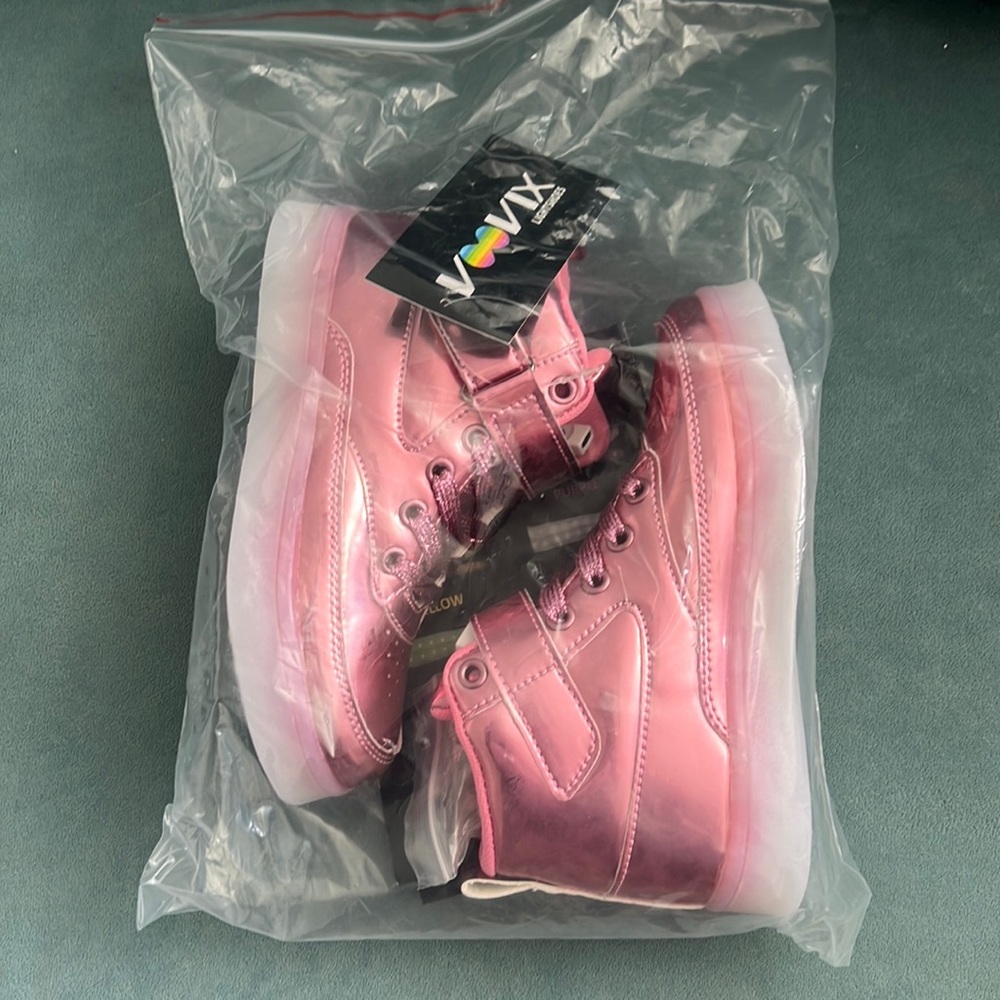 Pink light up shoes in a kids size 30 (12.5) new with plug and tags.